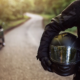 Rider holding motorcycle helmet