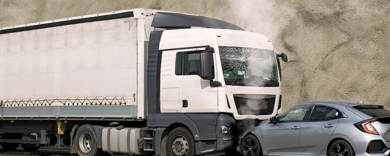 Truck and car in head on collision