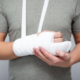 Man with broken arm in cast